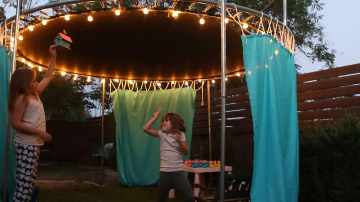 girls playing in a trampoline fort
