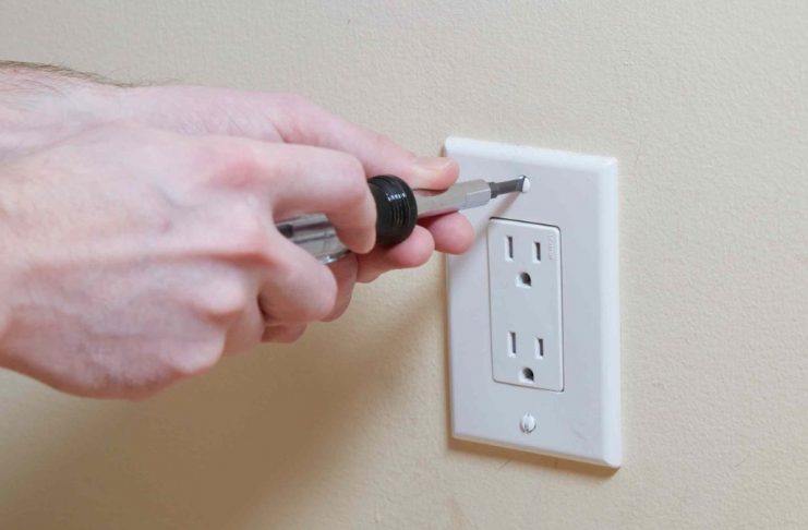 removing outlet cover to paint and prevent fire hazard